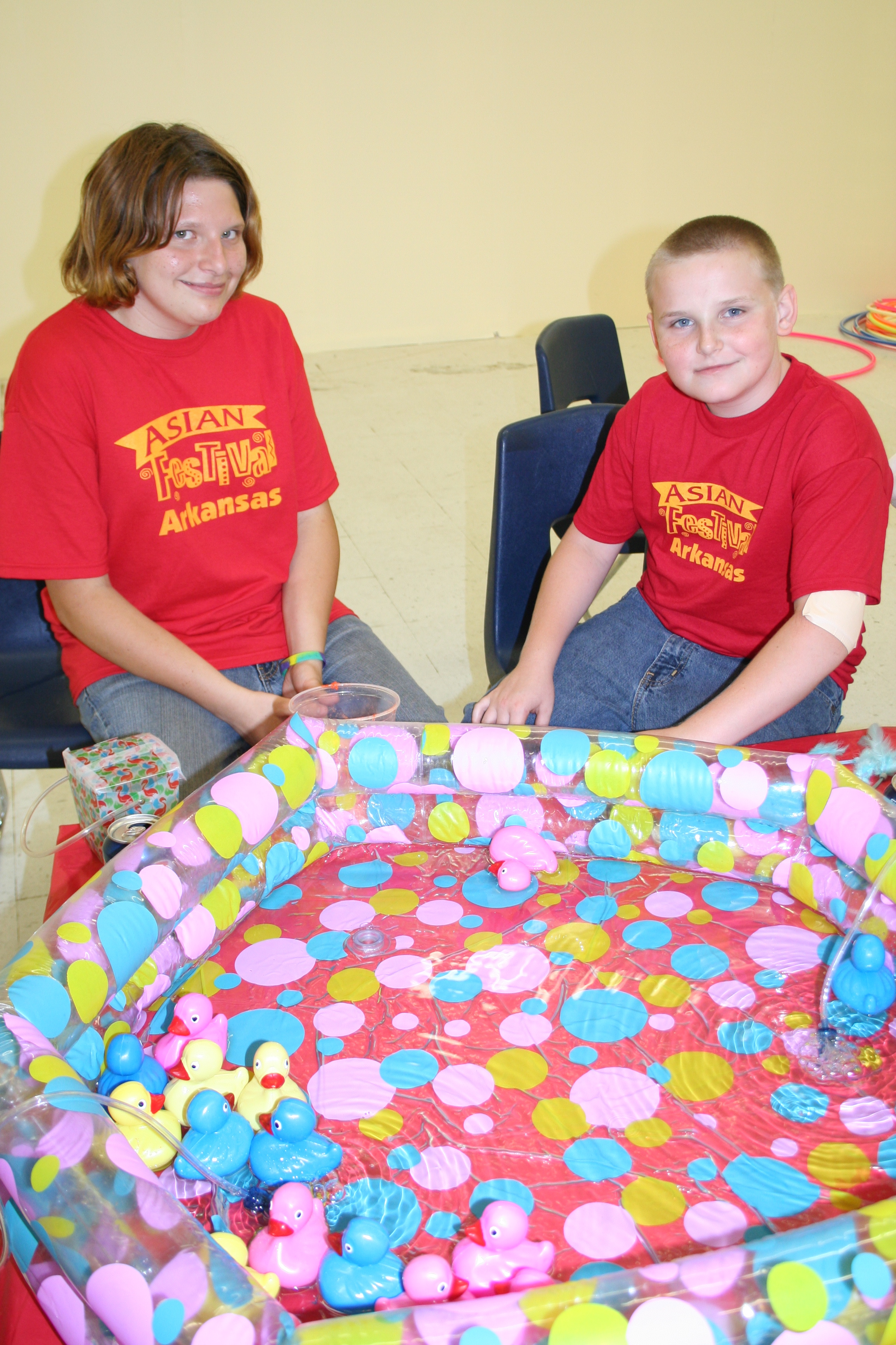 Kerrie Uptain and Blake Morris work at a booth.