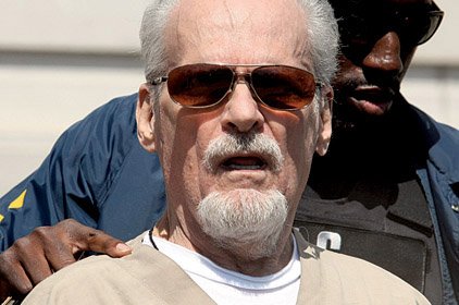 This file photo shows Tony Alamo being led from the federal courthouse in Texarkana on July 23, 2009. A jury Thursday awarded two men $66 million for their claims of abuse by Alamo.