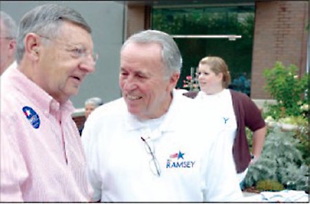 Fred Vorsanger, left, talks with Bill Ramsey before Ramsey officially announces his candidacy Saturday for state representative in District 92 in front of the Fayetteville Town Center.