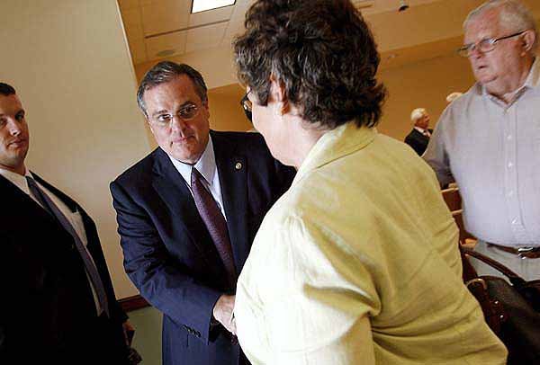 U.S. Sen. Mark Pryor greets Suzanne Santiago, a registered nurse with hospice at Washington Regional Medical Center in Fayetteville, after a town hall-style meeting Tuesday with hospital staff at the Pat Walker Center for Seniors in Fayetteville.