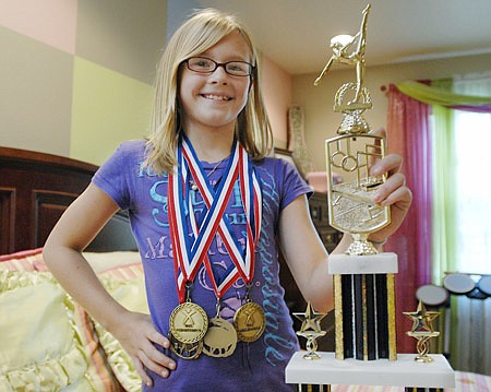 Kayla Johnson, 10, of Bryant has won several awards as a gymnast, including state champion in her age group.