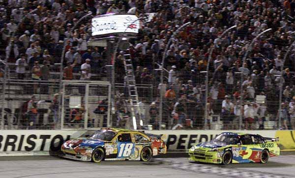 Kyle Busch (18) edged Mark Martin (5) for the victory at the finish line of the Sharpie 500 at Bristol Motor Park in Bristol, Tenn., on Saturday, pushing Busch to 13th in the points standings and moving Martin up to 10th.