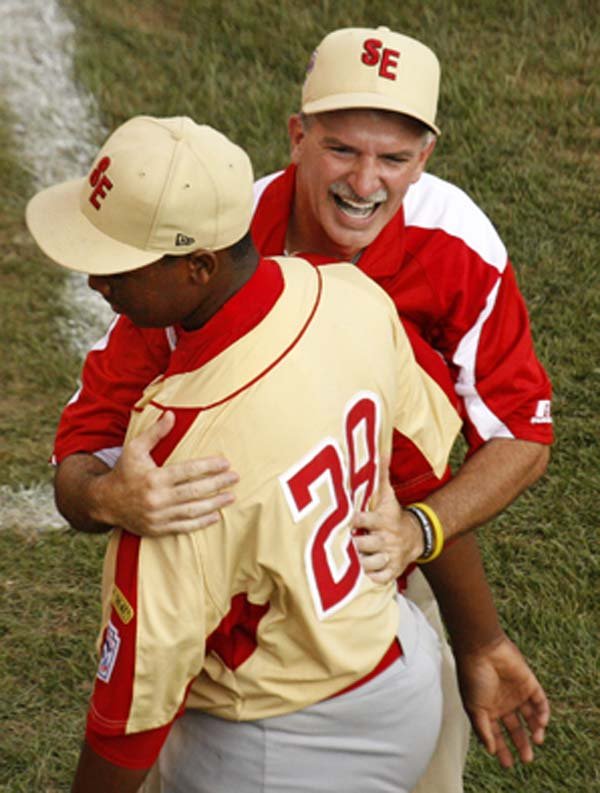 Warner Robins, Ga., Coach Randy Jones hugs pitcher Cortez Broughton after a 3-2 victory over Mercer Island, Wash., during the Little League World Series on Monday in South Williamsport, Pa.