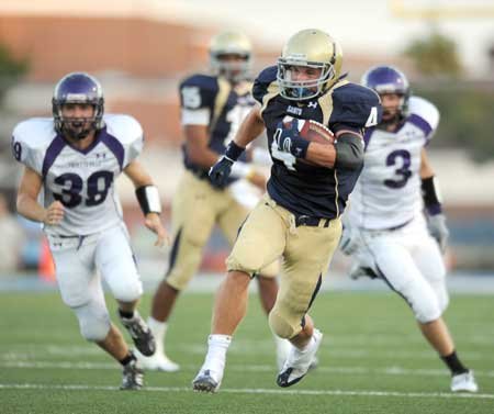 Christian junior running back Garrett Harper (4) carries the ball through the Fayetteville defense as senior linebackers Peyton Baker (39) and Bentley Banister (3) pursue him during the Dogs' and Saints' exhibition game Monday at Shiloh Christian in Springdale. 