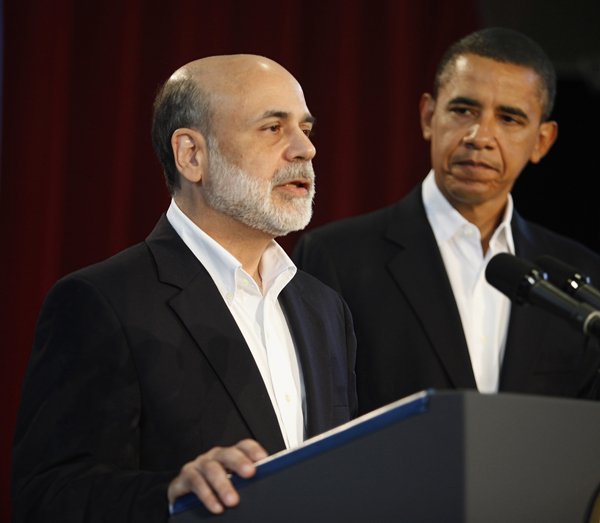 President Barack Obama looks on after announcing he is keeping Federal Reserve Board Chairman Ben Bernanke, left, for a second term, Tuesday.