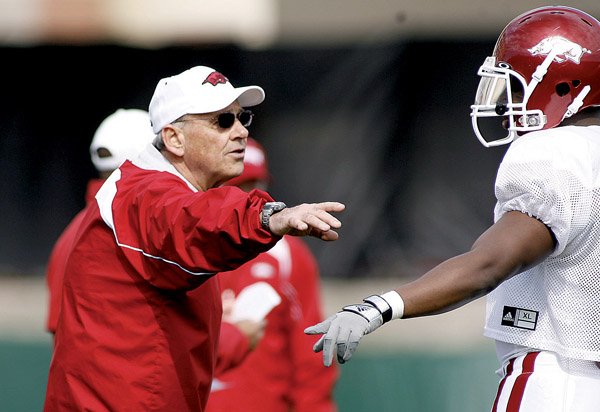 Arkansas assistant coach John L. Smith (left) was hired in the off-season to coordinate the Razorbacks' special teams, which were woeful at times last season. The 2008 season opener set the tone when the Razorbacks lost fumble on the opening kickoff.

