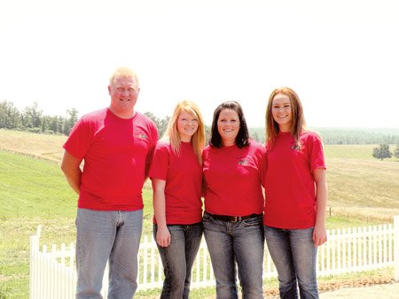 The Devon Smoot family of the Fryatt community near Mammoth Spring has been named the 2009 Fulton County Farm Family of the Year. Pictured are Devon, 39, from left, his daughter, Sierra Leigh, 17, his wife, Janet, 37, and his daughter, Shyannia Taylor, 15. The family raises cattle and hay on their 480-acre farm.