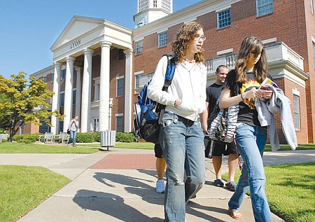Minnie Smith, left, and Catherine Gasaway head to class at Lyon college. The school is seeing its highest enrollment ever this fall.