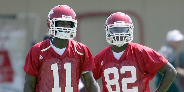 Arkansas freshman receivers Cobi Hamilton (11) and Lance Ray (82) run drills during practice Friday, August 7, 2009 at the practice field in Fayetteville.