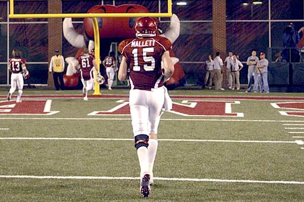 Arkansas quarterback Ryan Mallett leaves the field after throwing for a school-record 408 yards in a loss.