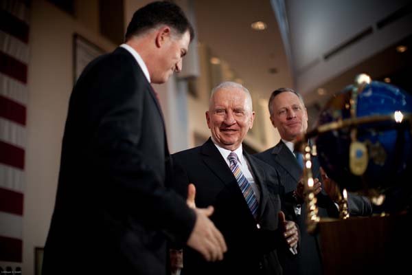 Michael Dell, chief executive officer of Dell Inc., and Ross Perot Sr., chairman emeritus of Perot Systems, shake hands Monday after announcing Dell's acquisition of Perot Systems for $3.9 billion in this photo provided by Perot Systems.