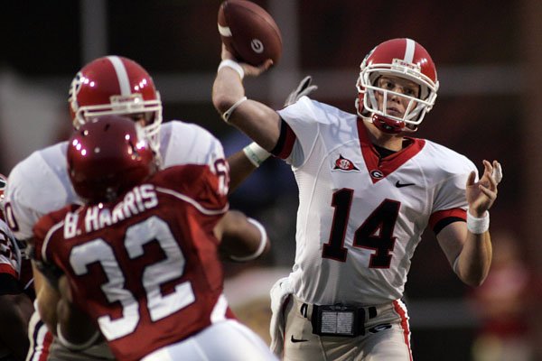 Georgia quarterback Joe Cox completed 18 of 26 passes against Arkansas, but threw for 375 yards and a school-record five touchdowns in the Bulldogs' 52-41 victory Saturday in Fayetteville. 
