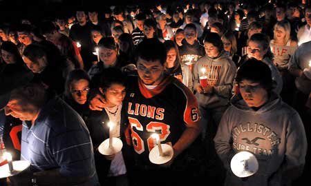 Family, friends and Gravette High School students came out to pay their respects Wednesday evening at a candlelight vigil for Gravette football player Casey Russell, who died early Wednesday morning.

