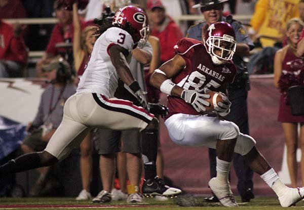 Arkansas wide receiver Greg Childs (right) scores a touchdown in Saturday's 52-41 loss to Georgia. Childs, who had 5 catches for 140 yards and 2 touchdowns in the game, had moments of uncertainty during spring drills.