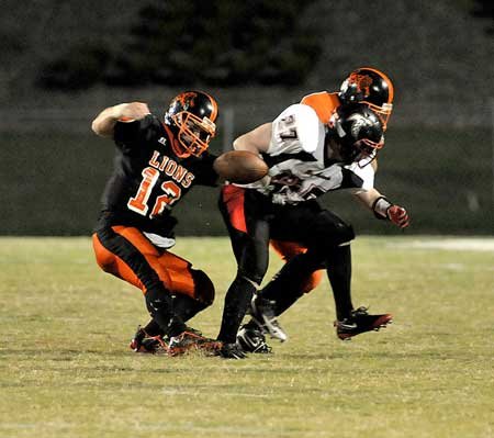 Gravette senior Colt Moorman stripped the football from Pea Ridge senior Nathan Norris and the Lions recovered the fumble during the second quarter of Friday night's game at Lion Stadium in Gravette. 