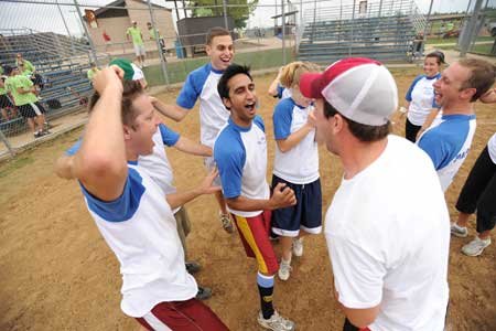 Vik Dudheker, center, and the rest of the members of Papa Smurf and the 9 Dwarfs celebrate their 4-1 win over the Brew Dogs Sept. 20 at the Randal Tyson Sports Complex in Springdale. 

