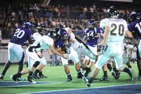 Fayetteville senior receiver Michael Heintzman (4) scores a touchdown out of the Wilddog formation during the second quarter of play Friday at Harmon Field. 

