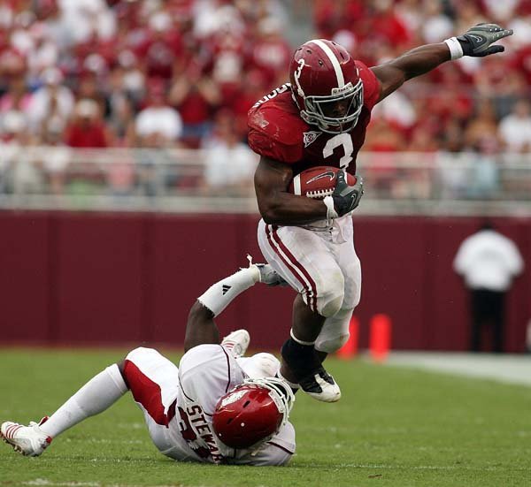 Alabama running back Trent Richardson (3) runs past Arkansas' Andre Stewart during last week's game. Richardson was selected as the SEC freshman of the week after rushing for 65 yards on nine carries, including a 52-yard touchdown run.