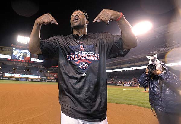 Los Angeles center fielder Torii Hunter celebrates after an 11-0 victory over Texas on Monday night clinched the American League Western Division title for the Angels.