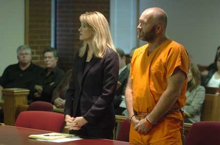 Terry Hayes stands in Circuit Judge William Storey’s courtroom with his lawyer, Kristin Pawlick, in the Washington County Courthouse on Tuesday just before being sentenced to 40 years in prison for aggravated assault on a family member.

