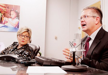 Department of Education Deputy Commissioner Diana Julian listens to Commissioner Tom Kimbrell announce how the state's school districts are measuring up.