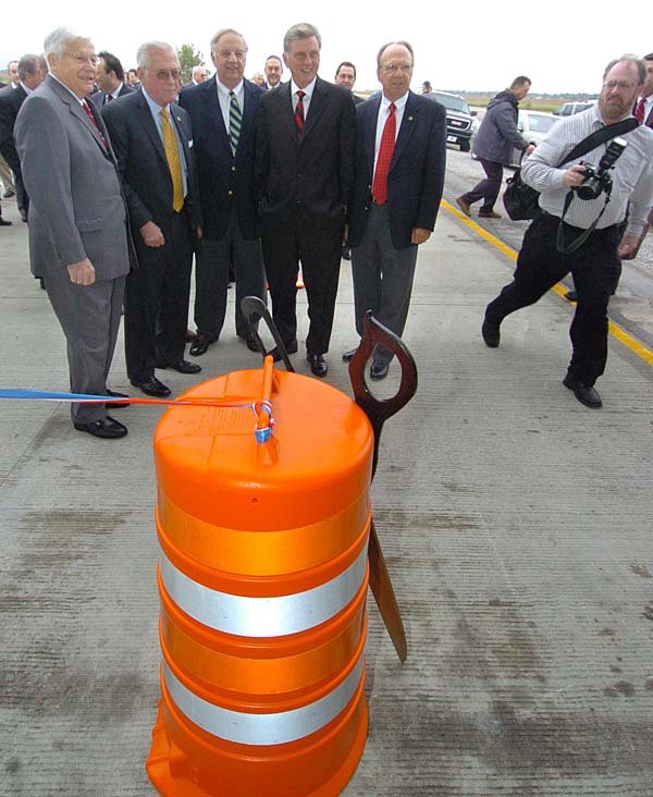 Highway officials and Gov. Mike Beebe get ready to help open the new section of U.S. 67 at Newport on Wednesday.
