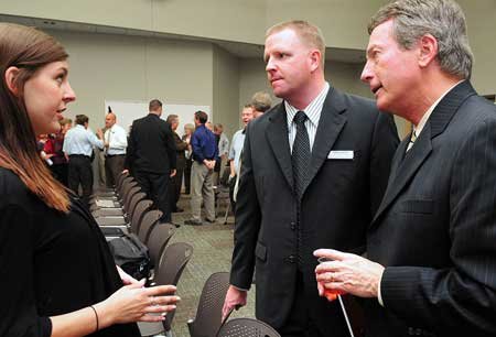 Superintendent Gary Compton, right, and Steve Potts, executive director of human resources for the Bentonville School District, talked with Libby Wolfe, 17, of Bentonville before a Bentonville School Board meeting held at the Bentonville Public Library in October 2009.