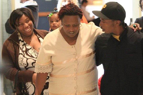  Jacqueline Burnett (center), Curtis Vance's mother, is comforted by family members Thursday after testifying in her son's trial.