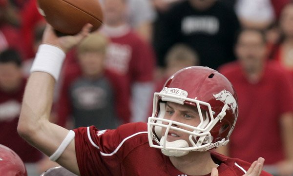 Arkansas quarterback Ryan Mallett passes under pressure from Mississippi State defensive tackle Sean Ferguson.