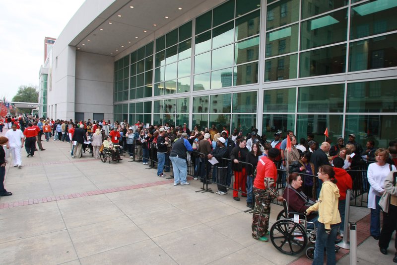 People line up for the free medical clinic outside the Statehouse Convention Center in Little Rock. More than 1,000 doctors and volunteers participated in the event.
