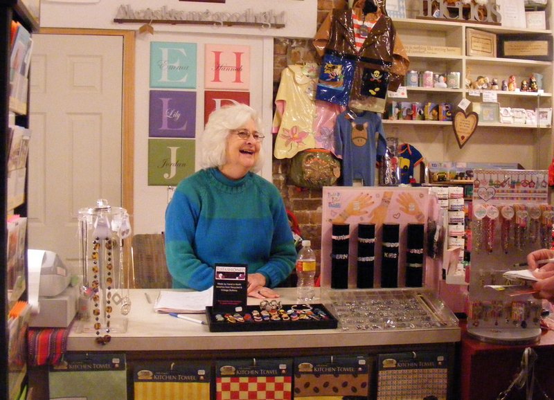 Dina Landis’ runs her shop, Small World, seven days a week in downtown Eureka Springs. 
