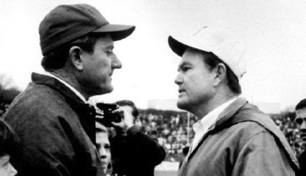 Arkansas football coach Frank Broyles, left, and Texas coach Darrell Royal greet on the field in Fayetteville, in this Dec. 6, 1969, file photo. No. 1 Texas defeated No. 2 Arkansas, 15-14. 