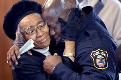 Ruth Budd (left) consoles grandson Orlando Green following Saturday’s memorial service for Green’s sister, Carmeletta, at New Jerusalem Missionary Baptist Church in Little Rock. Green’s sister, and Budd’s granddaughter, disappeared in 1982 at age 12. 