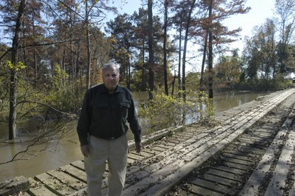 Curtis Merrell stands in front of Bayou Bartholomew, which at 350 miles in length is said to be the longest bayou in the world. Merrell was named a hero of conservation by Field & Stream magazine recently for his efforts in restoring the bayou.