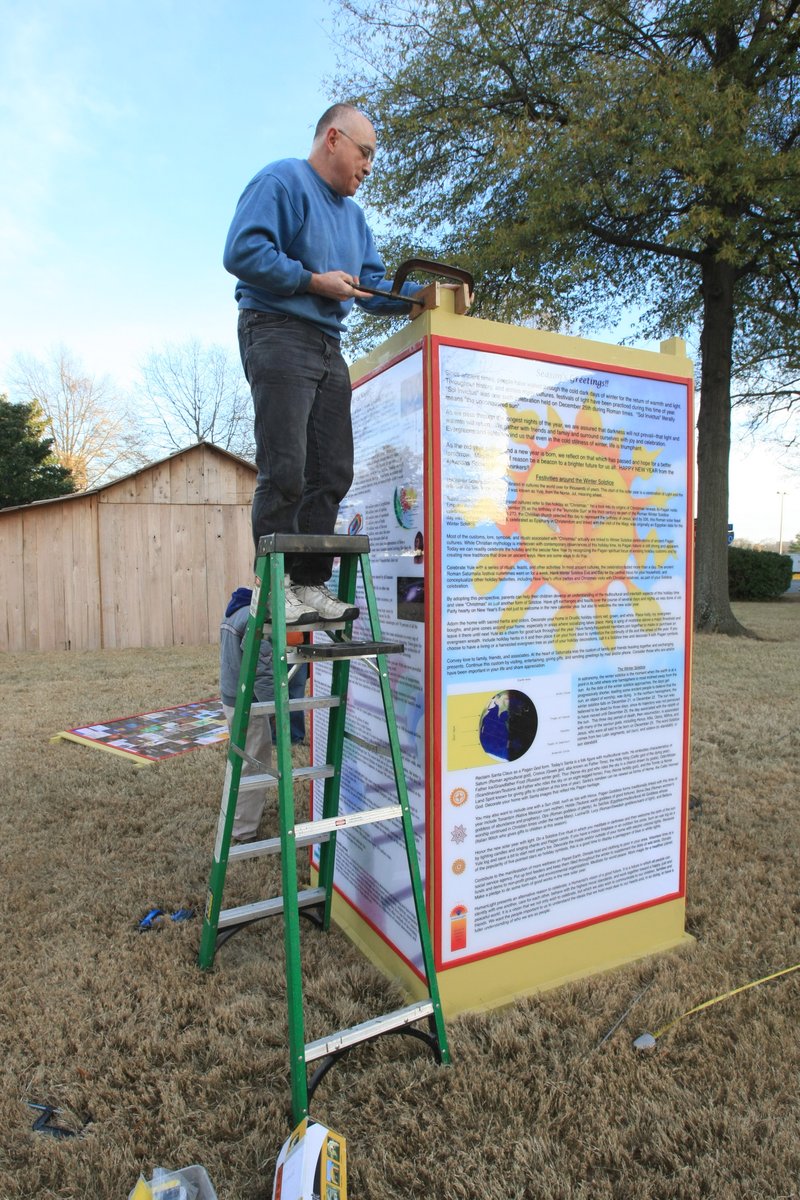 FILE — Mark Love of the Arkansas Society of Freethinkers works Wednesday, December 16, 2009 to set up a winter solstice display on the grounds of the state Capitol. A federal judge ruled that the secretary of state's office must let the group set up their display.