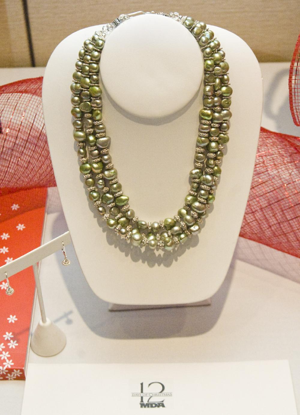 Arkansas Democrat-Gazette photo by Cary Jenkins 120909A pearl necklace and earring set was one of the silent auction items