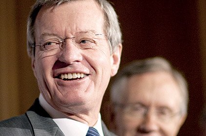 Sen. Max Baucus of Montana (front) and Senate Majority Leader Harry Reid of Nevada talk about the Senate’s health-care bill Monday in Washington.