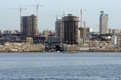 Construction continues on towers in Luanda, Angola, last week. OPEC ministers are meeting today in the African capital.