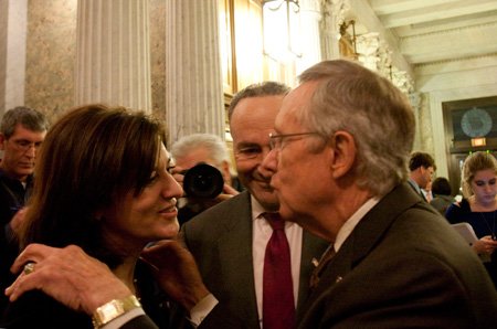 Victoria Reggie Kennedy, widow of the late Sen. Ted Kennedy, D-Mass., greets Senate Majority Leader Harry Reid, D-Nev., as Sen. Chuck Schumer, D-N.Y., center, watches following a 60-40 cloture vote which is the first step on passing a health care bill on Capitol Hill in Washington.