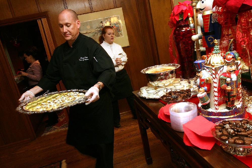 Arkansas Democrat-GazetteWILLIAM MOOREMorgan Stout, Director of Operations for Chartwell's, carries a tray of food while catering a party in the home of Mary Ann and Reed Greenwood Sunday, December 6, 2009 in Fayetteville. For northwest profiles, inside.