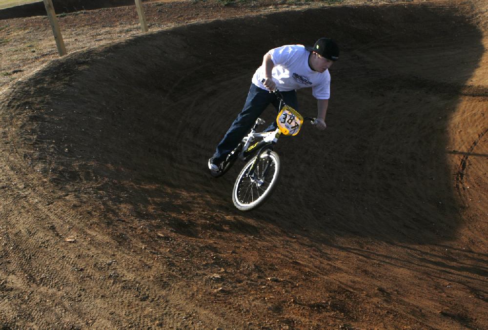 Arkansas Democrat-GazetteBOB COLEMAN--122109--Dustin Upshaw, 13, of Lowell practices riding the track at Mudtown BMX on McClure
Ave. in Lowell Monday afternoon. Upshaw hopes to join a racing team in the coming season.