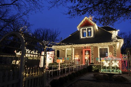 The McClain home at 606 N. Fifth St. in Rogers has a large Christmas light display on their property. The family has been putting on the display for eight years and starts stringing light in August.