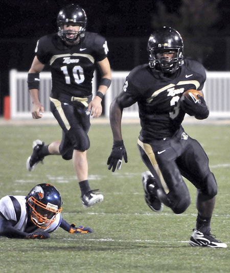 Bentonville running back Courtney Haskell scores a touchdown against Rogers Heritage on Oct. 9 in Tiger Stadium in Bentonville. Haskell is the All-Northwest Arkansas Big 6 Newcomer of the Year.
