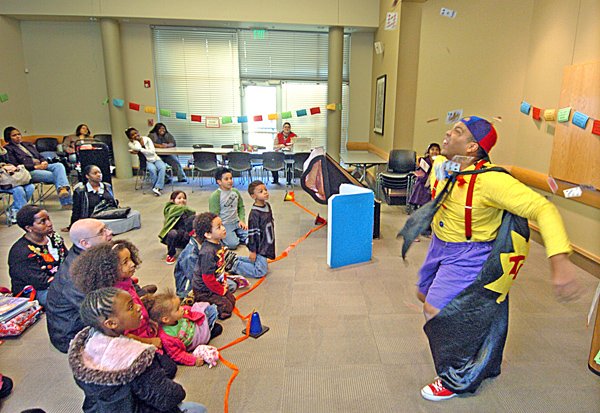 Tommy Terrific (Tommy Diaz) performs his Wacky Magic Show at the Little Rock McMath Public Library Branch.