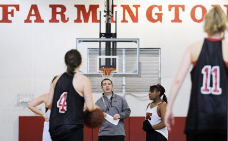 Farmington girls basketball coach Brad Johnson instructs his players during practice Tuesday in Farmington.