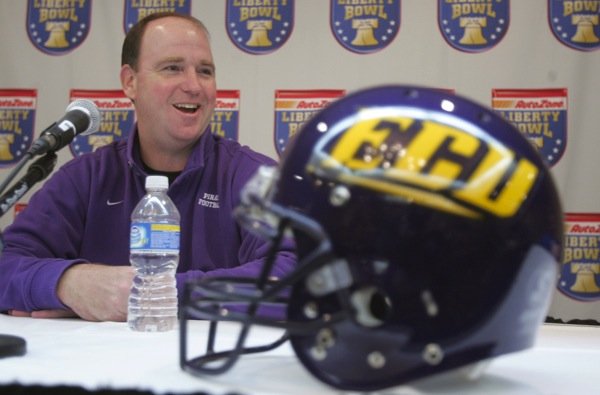 East Carolina Coach Skip Holtz speaks to the media Monday in preparation for his team's Liberty Bowl game against the Razorbacks.