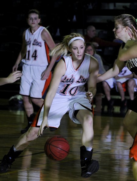 Gravette’s Julia Himsl drives to the hoop against West Fork in the Alma Classic on Wednesday in Alma.