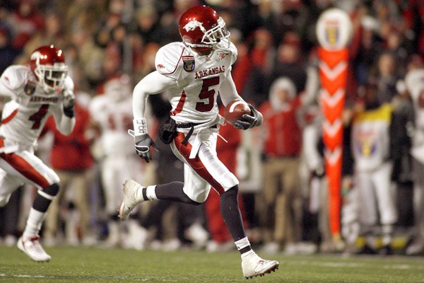 Safety Tramain Thomas (5) and the Arkansas defense helped the Razorbacks earn their first victory in two seasons when scoring fewer than 25 points.