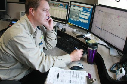 Communication specialist Chris Braithwaite sits at his console at Arkansas Children’s Hospital, which will get to keep communications equipment purchased by the federal Chemical Stockpile Emergency Preparedness Program when it shuts down in Arkansas by the end of 2010.