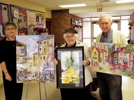 Showing some of their work that will be featured in the art show and sale at St. Peter’s Episcopal Church on Saturday are, from left, Bobbie Doll, Ann Drake and Gene Hatfield. All three artists attend the local church.